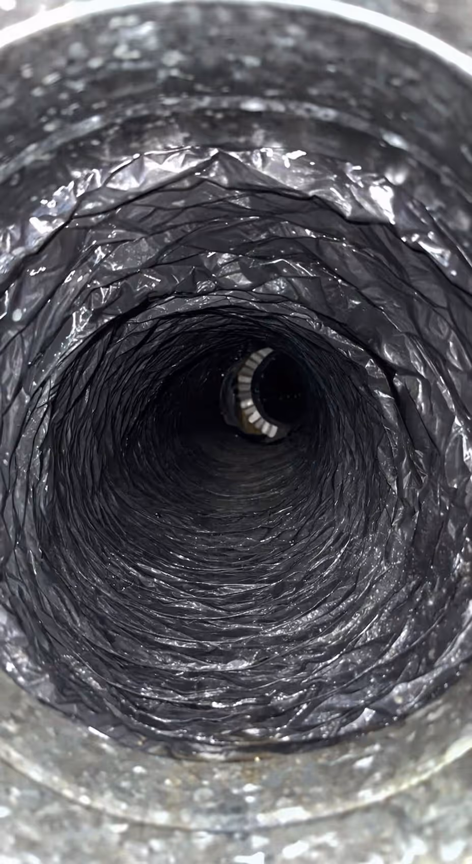 View looking into the inside of a corrugated flexible air duct.